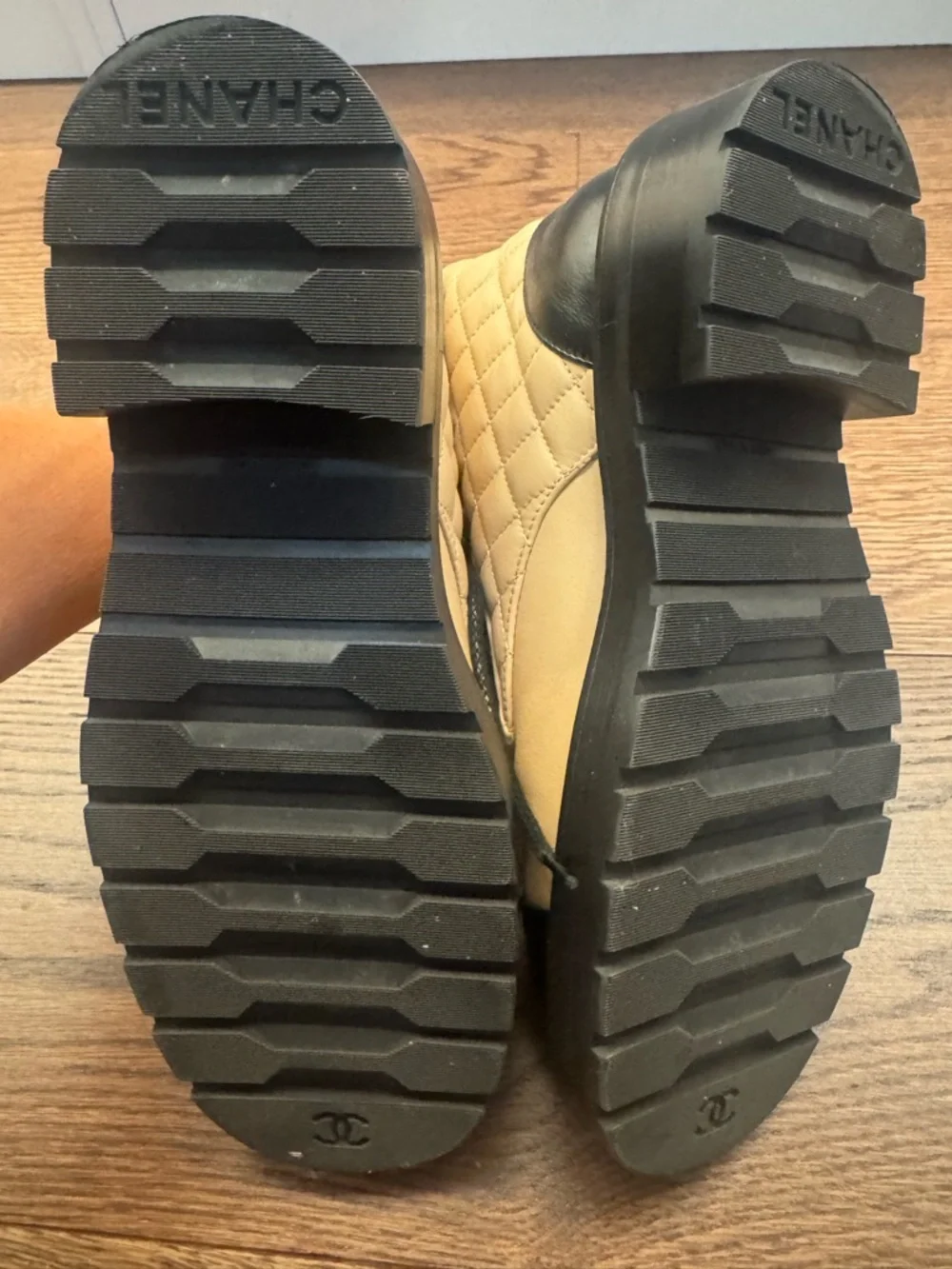 CHANEL Two-Tone Quilted Combat Boots in Beige and Black